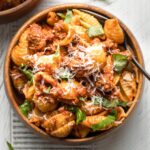 Bowl of pasta served with bolognese sauce.