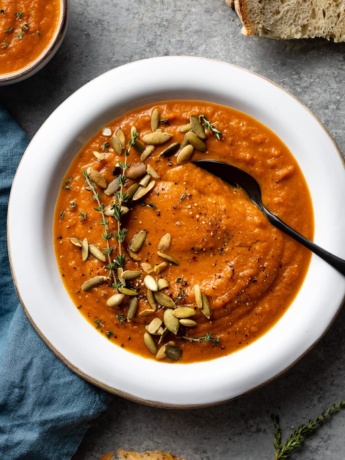 Bowl of creamy carrot red pepper soup.