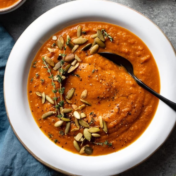 Bowl of creamy carrot red pepper soup.