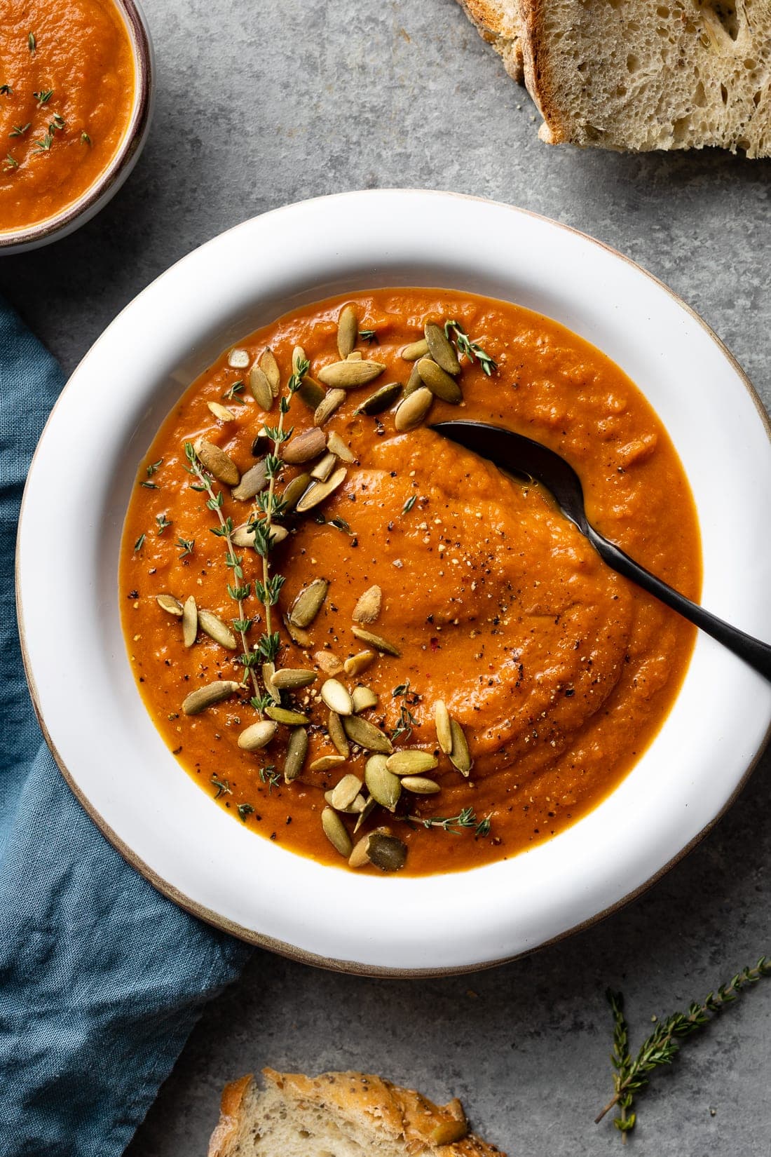 Bowl of creamy carrot red pepper soup.