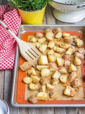 A baking sheet full of parmesan herb-crusted roasted red potatoes.