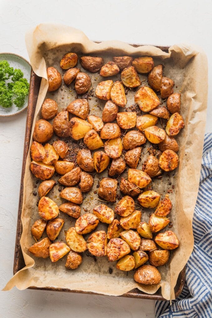 Baking sheet full of Parmesan roasted red potatoes.