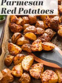 These Parmesan Crusted Red Potatoes are tossed with fragrant herbs and oven-roasted for a simple, versatile, and irresistible side dish. High heat gives these humble potatoes a deliciously crispy texture that will have you sneaking bites straight off the pan!