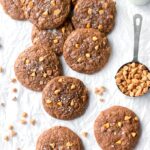 A scattered arrangement of toffee butterscotch brownie cookies.