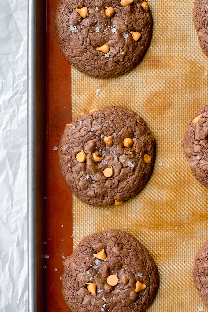 Just-baked toffee butterscotch brownie cookies, cooling on the baking sheet.