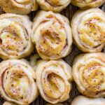 A close-up of turkey gouda party rolls with honey mustard glaze.