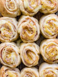 A close-up of turkey gouda party rolls with honey mustard glaze.