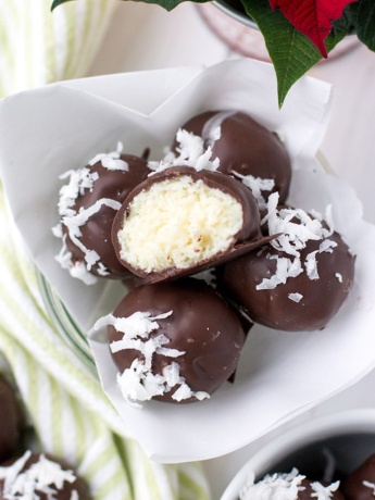 A close-up image of dark chocolate coconut truffles.