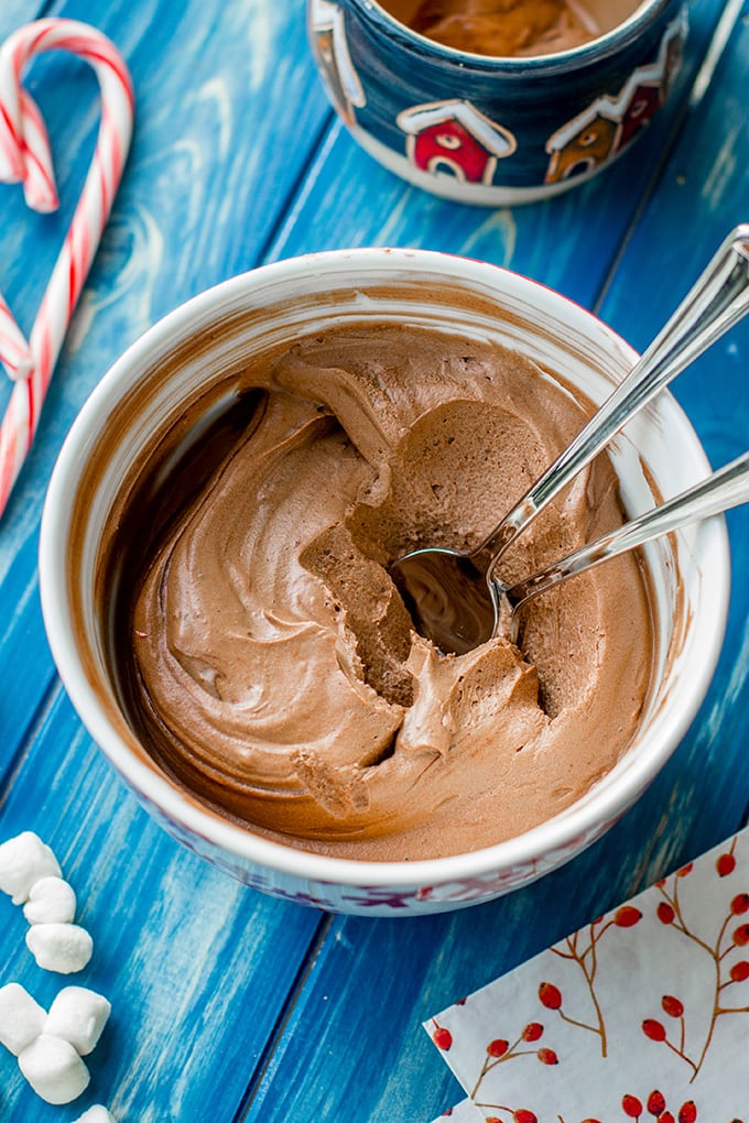 A bowl of classic French cocoa mix, with two spoonfuls removed.