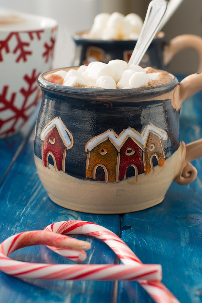 A mug full of classic hot cocoa topped with mini marshmallows.