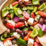 A traditional Greek salad is so delicious, healthy, and easy to make at home! This recipe includes a simple yet divine homemade dressing. It's light, fresh, and incredibly flavorful, thanks to the tang of red wine vinegar and zip of fresh dill.
