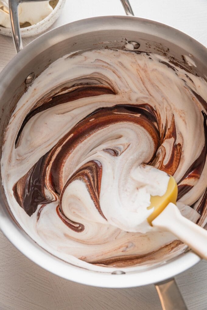 Whipped cream folded into melted chocolate.