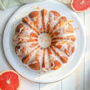 Flat-lay photo of glazed grapefruit bundt cake.