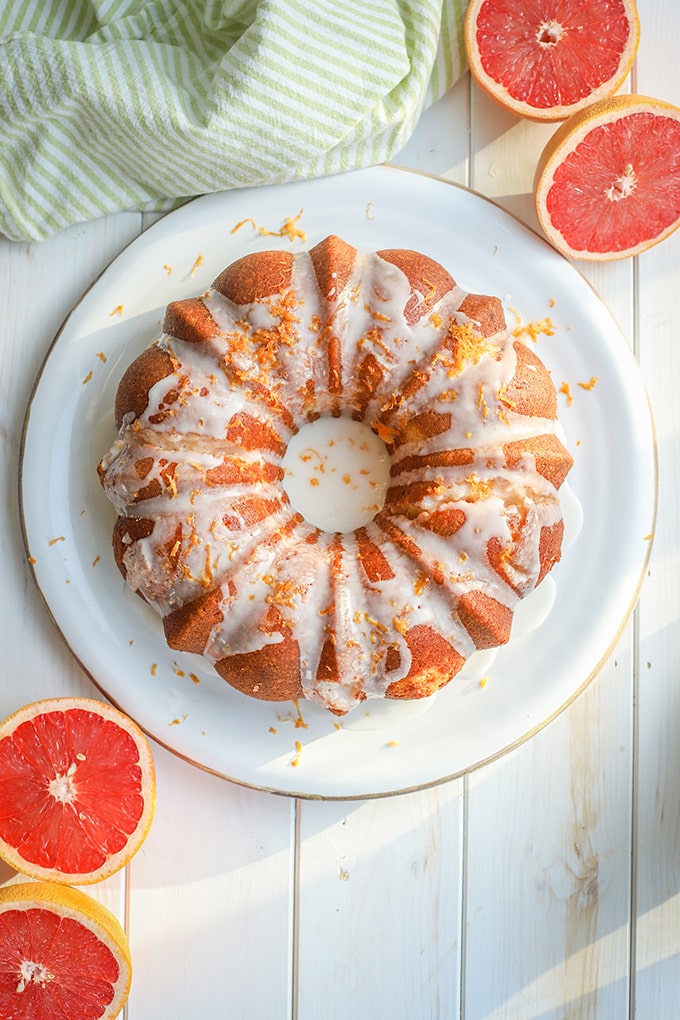 Flat-lay photo of glazed grapefruit bundt cake.