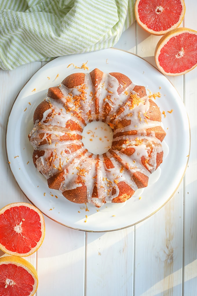 Flat-lay photo of glazed grapefruit bundt cake.