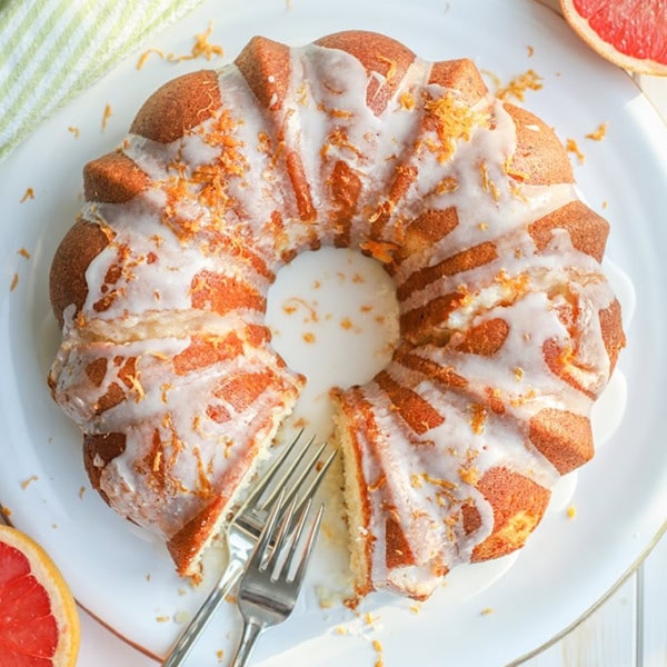 Flat-lay photo of glazed grapefruit bundt cake.