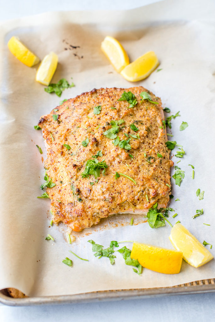 A large piece of salmon baked and coated with a crunchy mustard-panko crust.