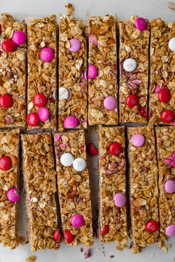 Flat-lay of freshly-cut M&M pretzel granola bars.