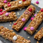 A slate tray filled with M&M pretzel granola bars.