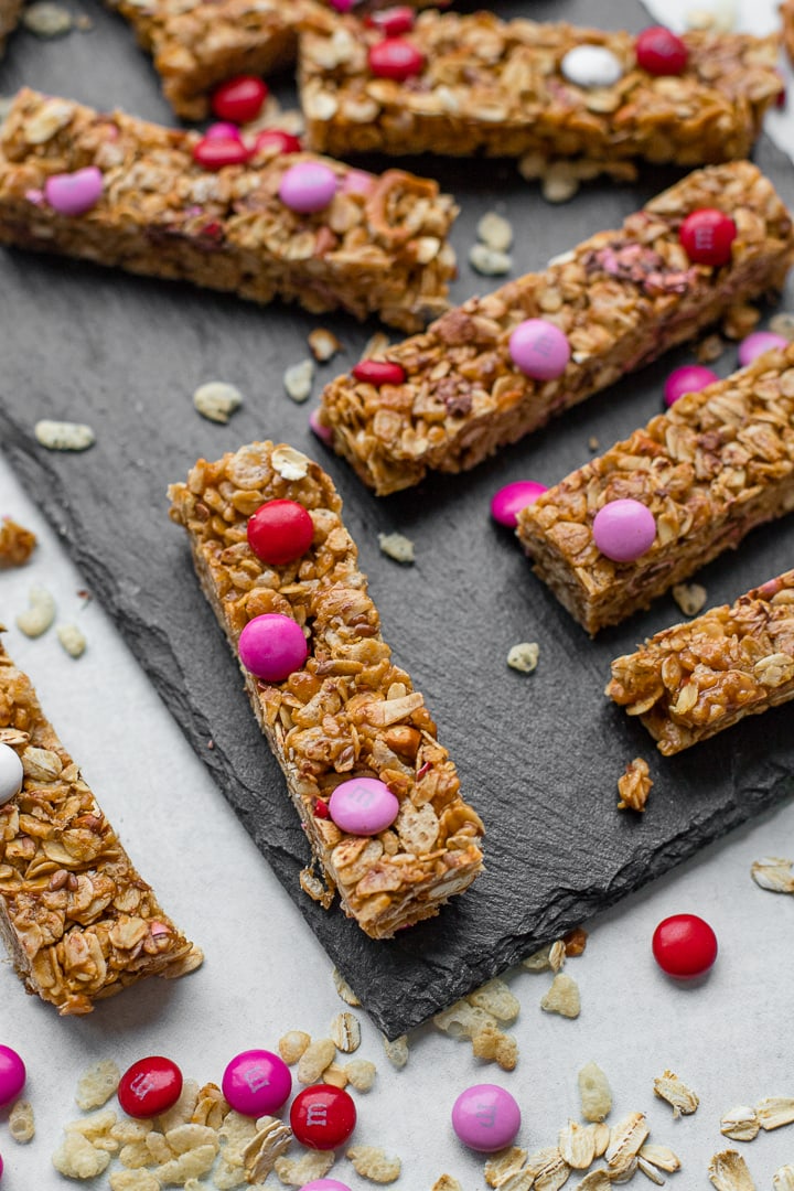 A slate tray filled with M&M pretzel granola bars.
