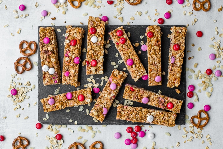 A slate tray filled with M&M pretzel granola bars.