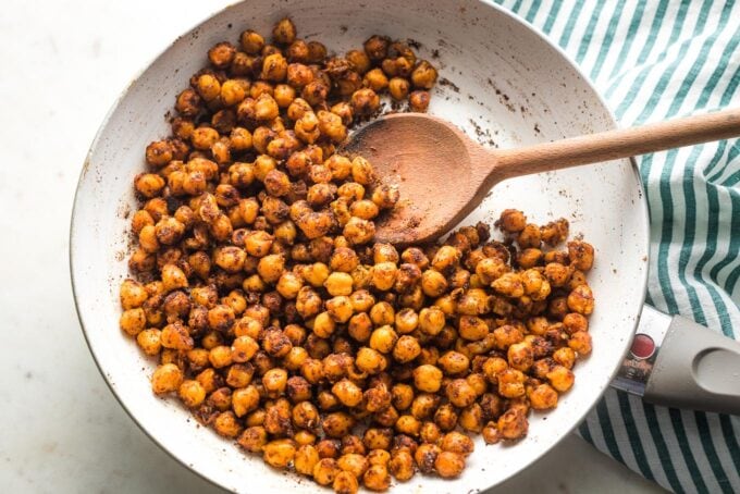 Crisped, seasoned chickpeas done in a skillet.