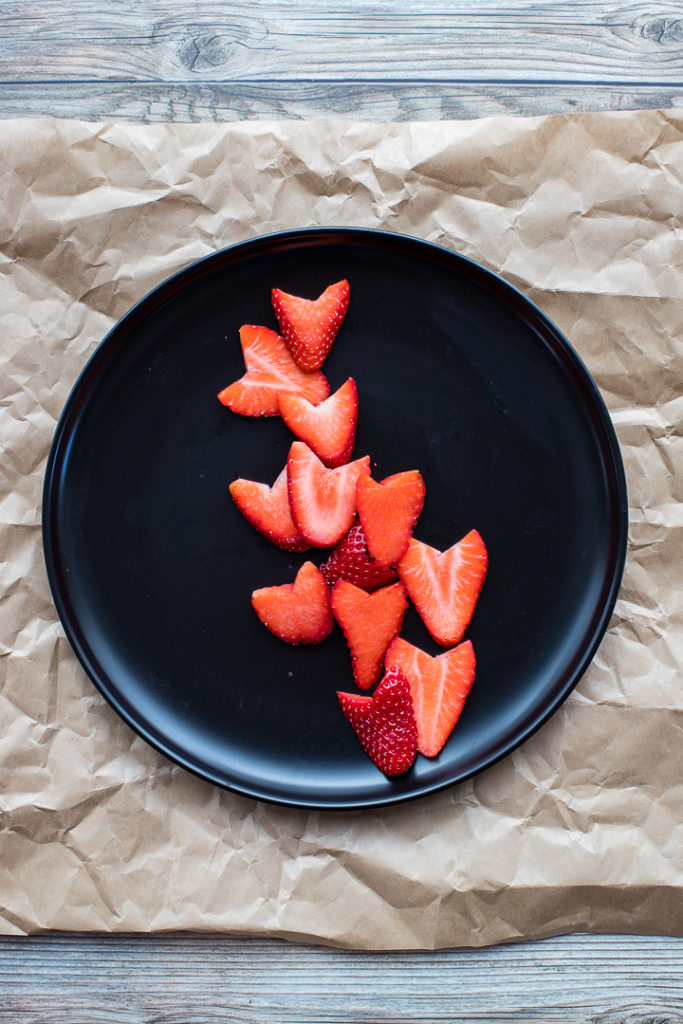 Strawberries cut into heart shapes.