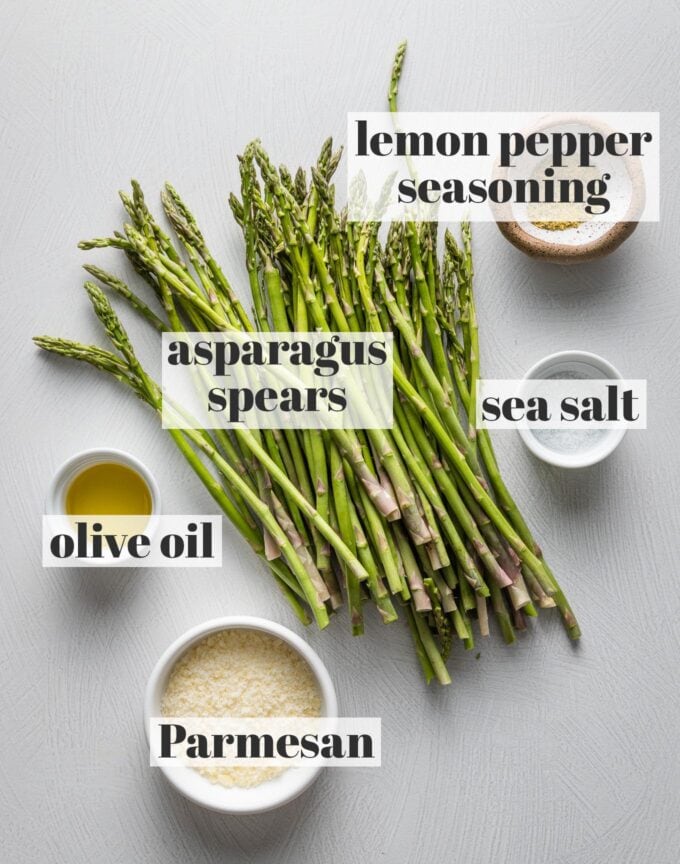 Labeled overhead image of asparagus spears, olive oil, lemon pepper seasoning, 
