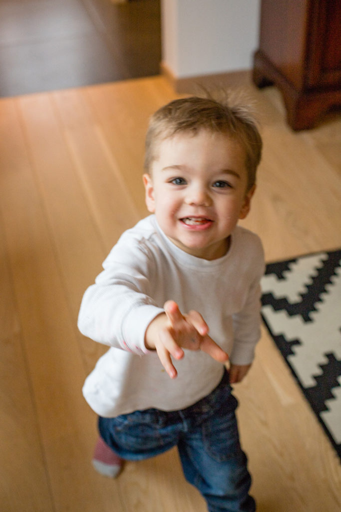 Smiling, running, happy toddler.