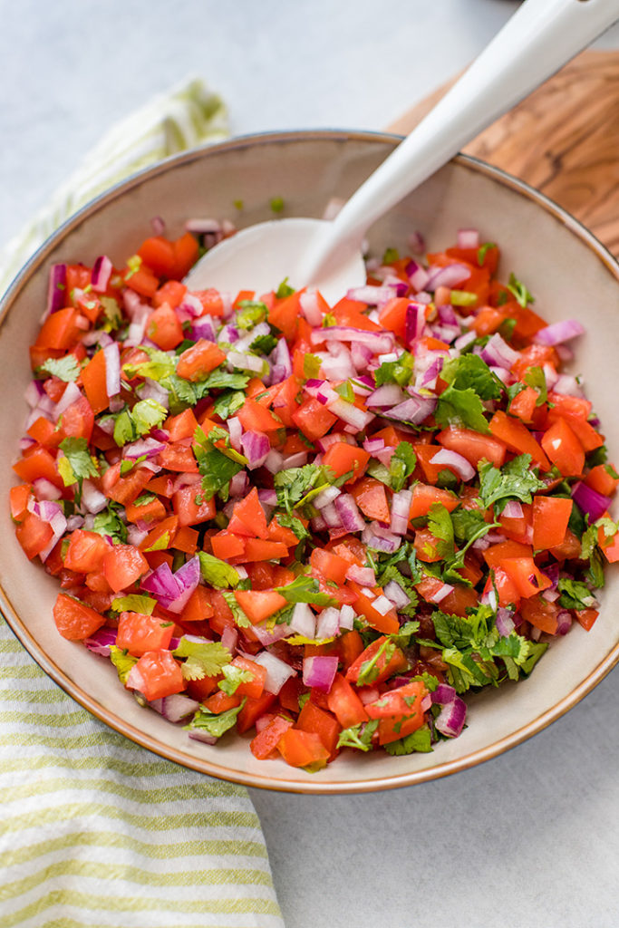 Close-up of a bowl full of homemade pico de gallo.