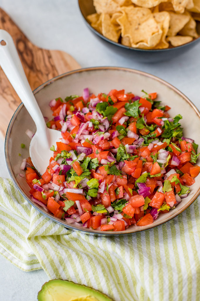 Close-up of a bowl full of homemade pico de gallo.