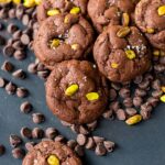 A pile of sea salt pistachio chocolate chip cookies.