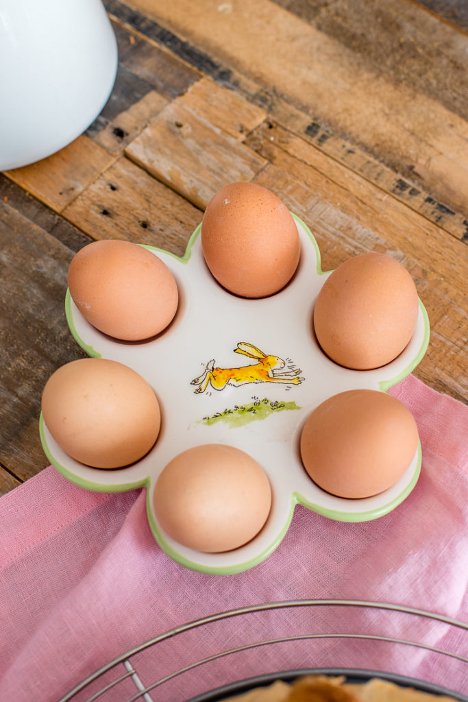 A ceramic dish for holding hard-boiled eggs with the bunny from "Guess How Much I Love you?" in the center.