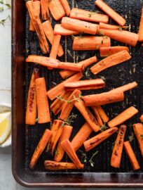 Roasted carrots with thyme are one of the simplest and yet most delicious side dishes I know. High heat brings out the natural sweetness of these veggies for a simple, healthy side that just may have people asking for seconds. I can happily even eat these as a snack.
