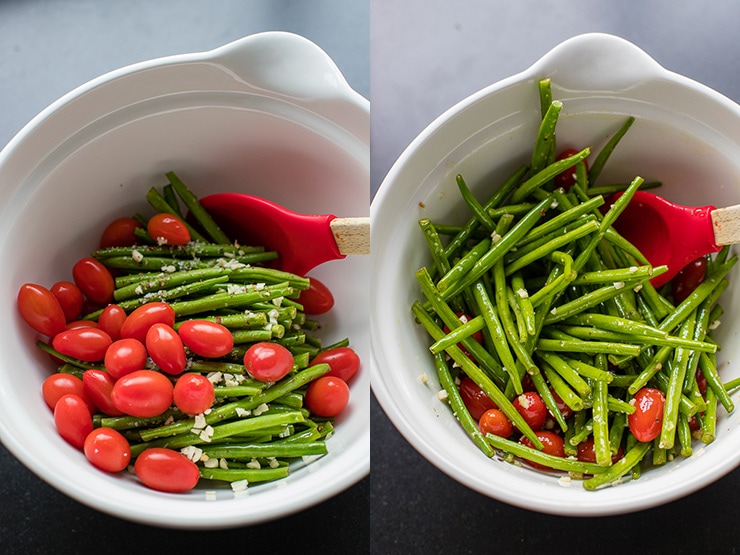 Garlic-seasoned green beans and cherry tomatoes mixed in a white bowl.