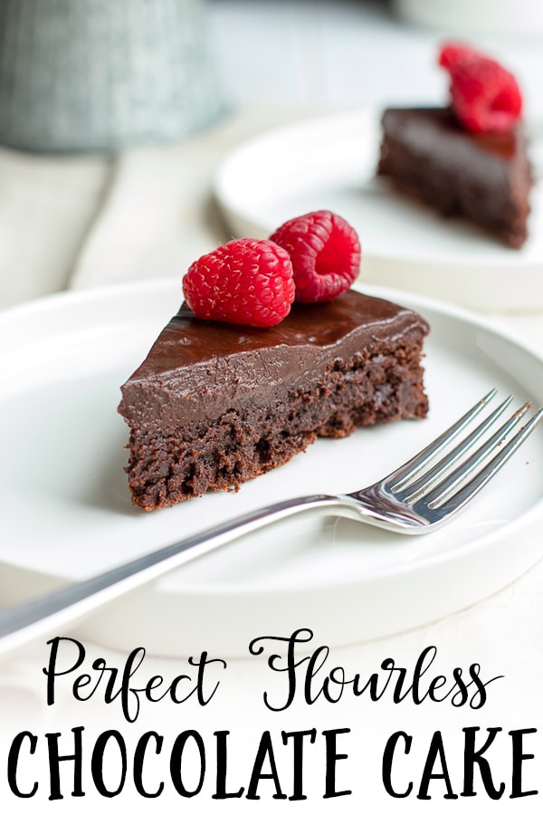 A fudgy, rich chocolate cake that is naturally gluten-free. Make this by hand in one bowl, then top with the easiest chocolate ganache (just chocolate and cream!) and fresh fruit for an impressive party dessert! #chocolatecake #glutenfree #glutenfreedessert #flourless 