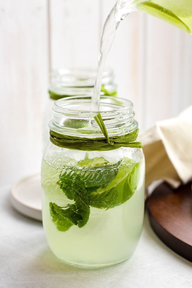 Two mason jars filled with sparkling limeade.