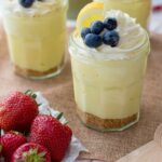 Jam jars filled with no-bake lemon cheesecake mousse.