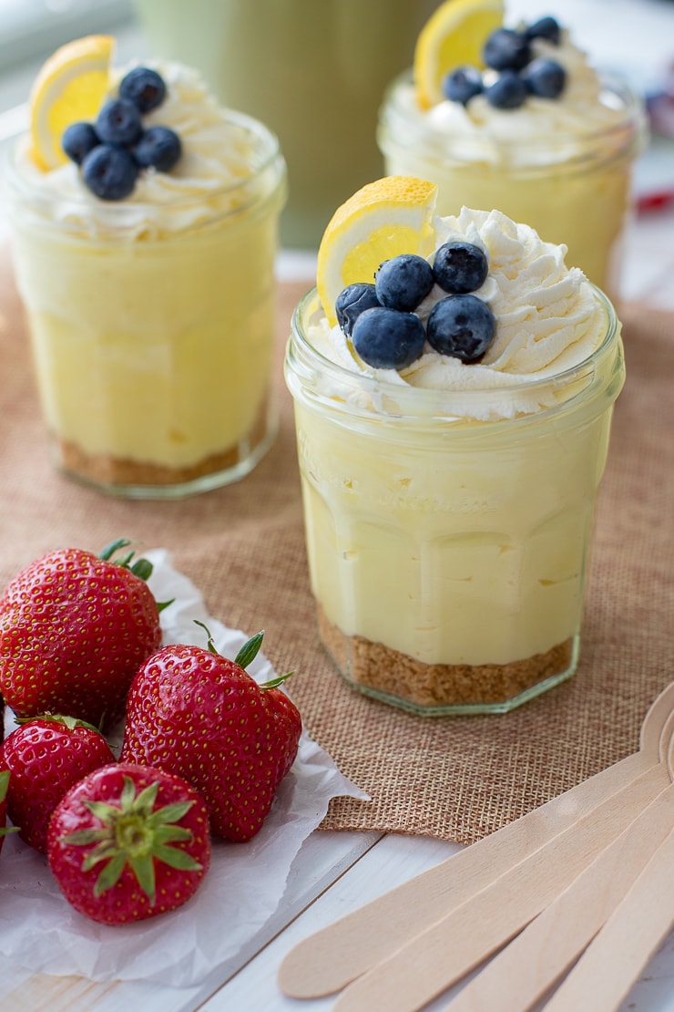 Jam jars filled with no-bake lemon cheesecake mousse.