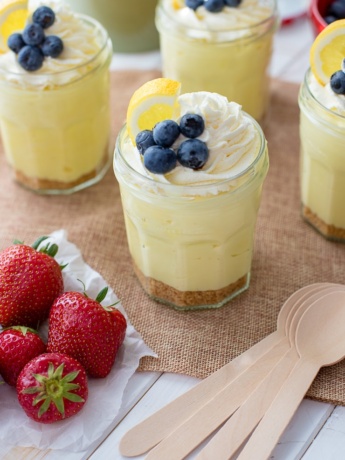 Jam jars filled with no-bake lemon cheesecake mousse.