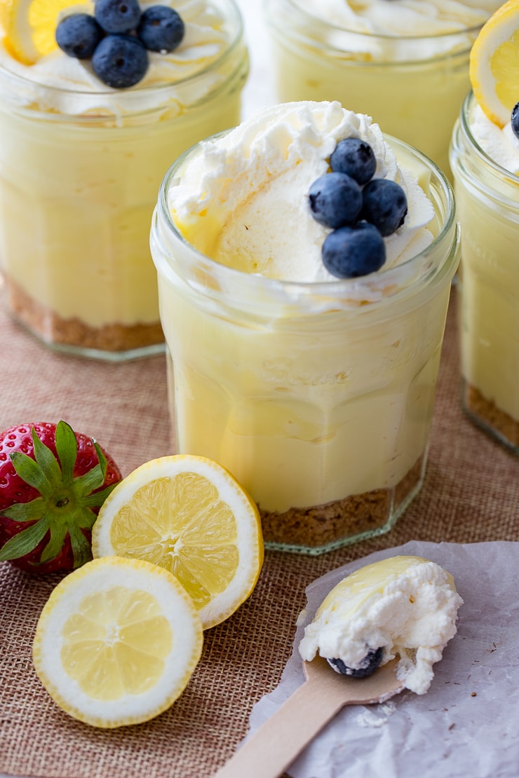 Jam jars filled with no-bake lemon cheesecake mousse.