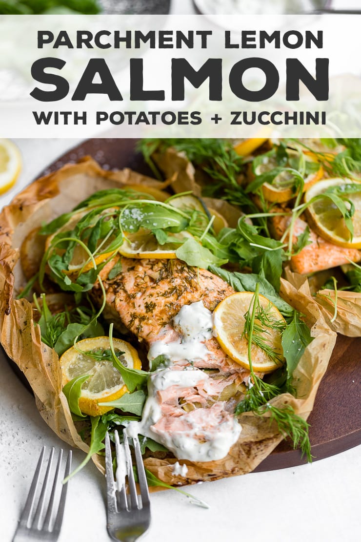 Parchment salmon baked with lemon slices, zucchini, potatoes, and the best light sauce makes an impressive, easy recipe for entertaining, date night, or any night! With a step-by-step visual guide on folding parchment packets - so much easier than you think! #parchmentfish #parchmentsalmon #recipesforentertaining