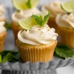 Close-up of a mojito cupcake on a galvanized cake platter.