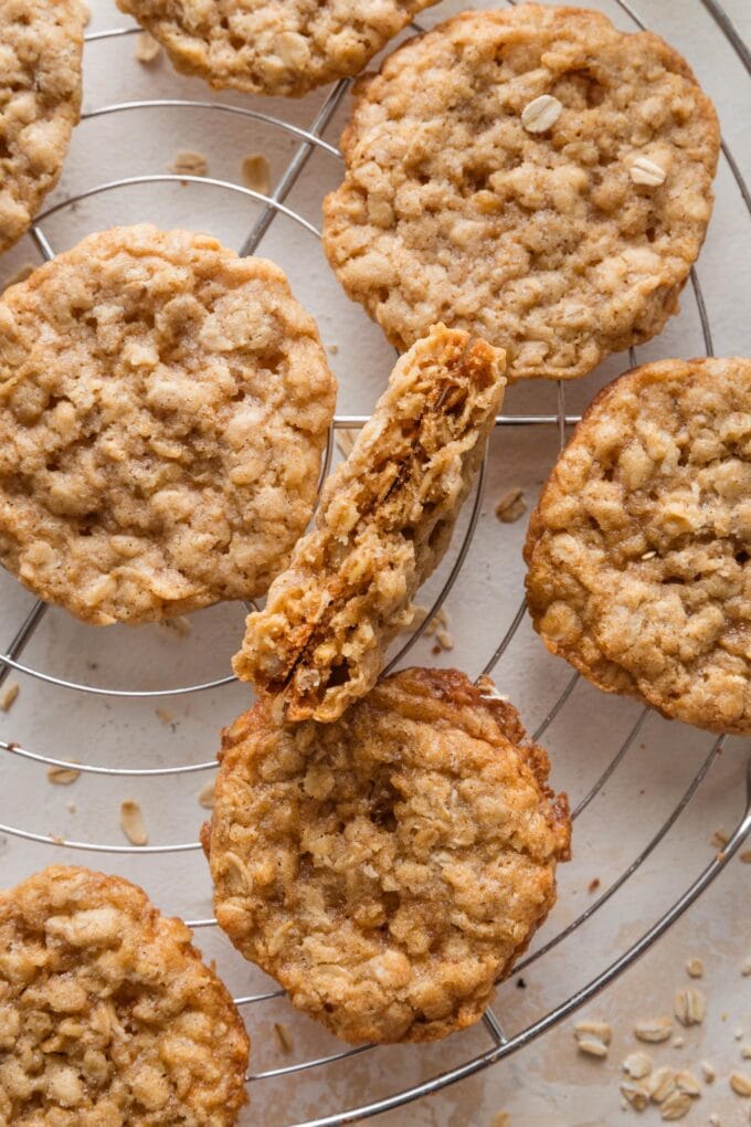 Close up of an old fashioned oatmeal cookie split in half to show the tender center.