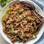 Serving bowl filled with slow cooked barbacoa beef.