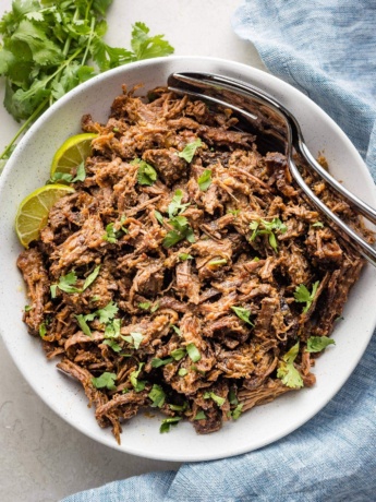 Serving bowl filled with slow cooked barbacoa beef.