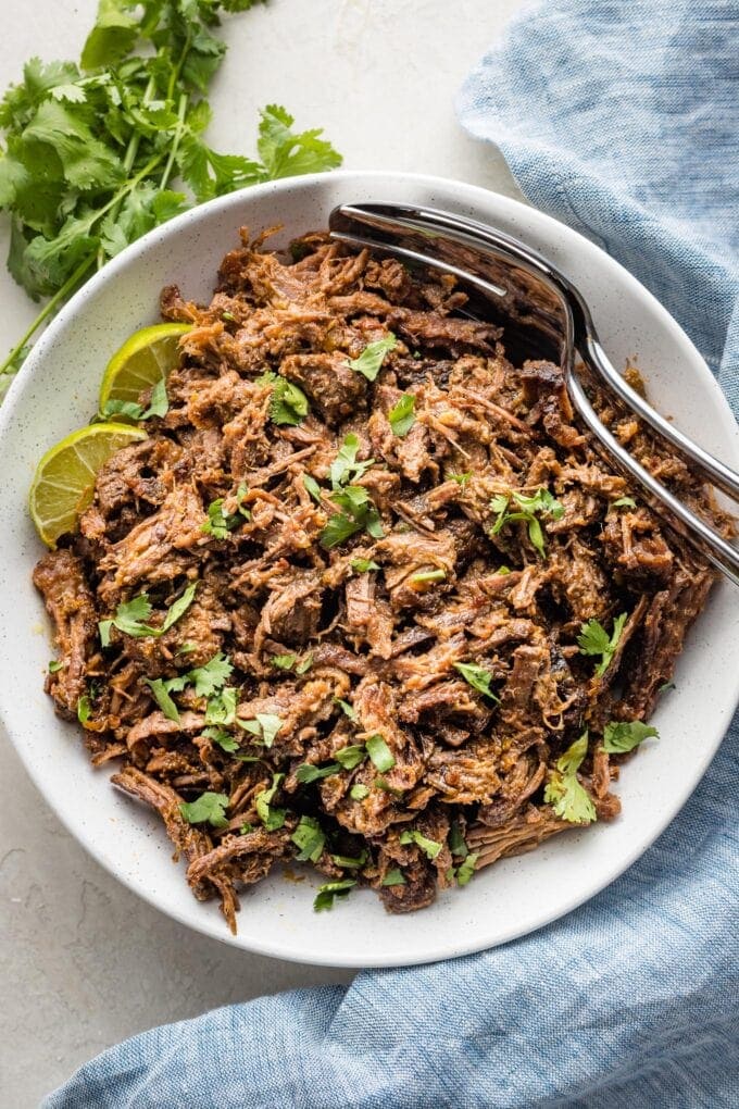 Serving bowl filled with slow cooked barbacoa beef.