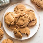 Small plate piled high with chewy ginger molasses cookies.