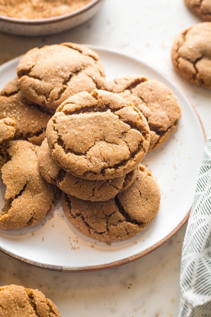 Angled view of a chewy ginger molasses cookie, ready to eat.