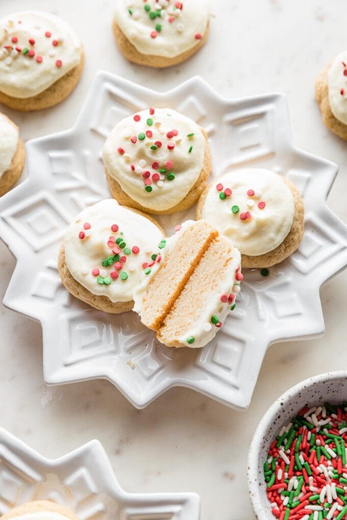 Close-up of an eggnog sugar cookie cut in half to show the soft, tender interior.